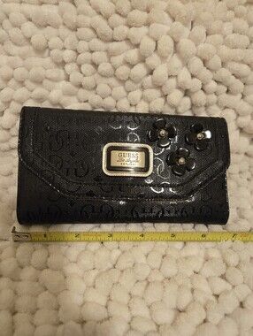 GUESS Black Patent Floral Accent Clutch Wallet with Gold Plaque